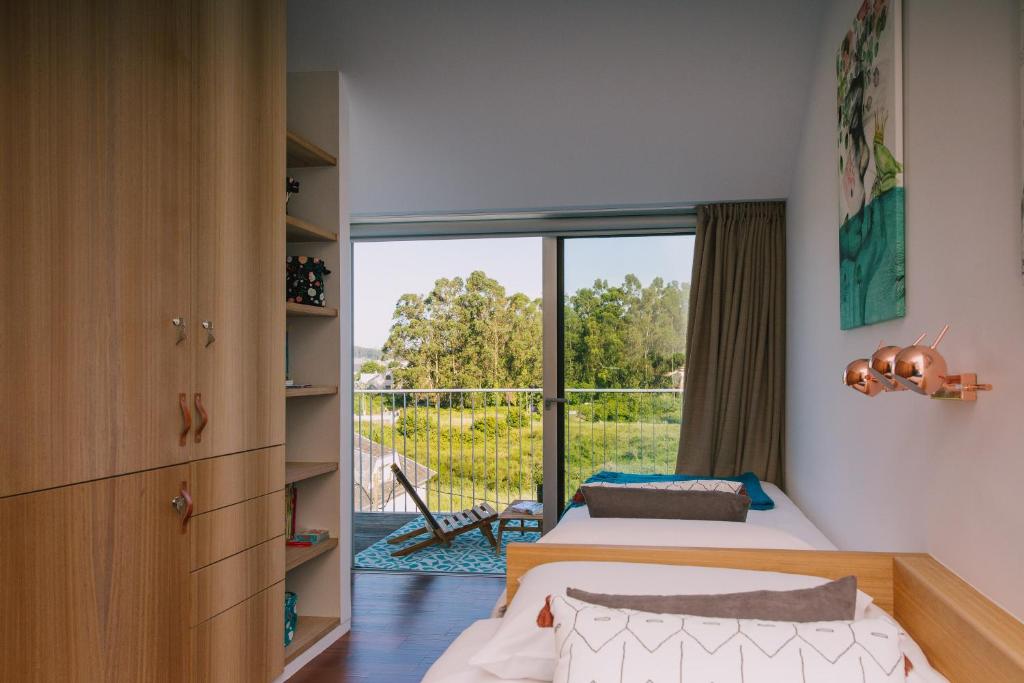 A bed or beds in a room at roomAREA vivienda turistica