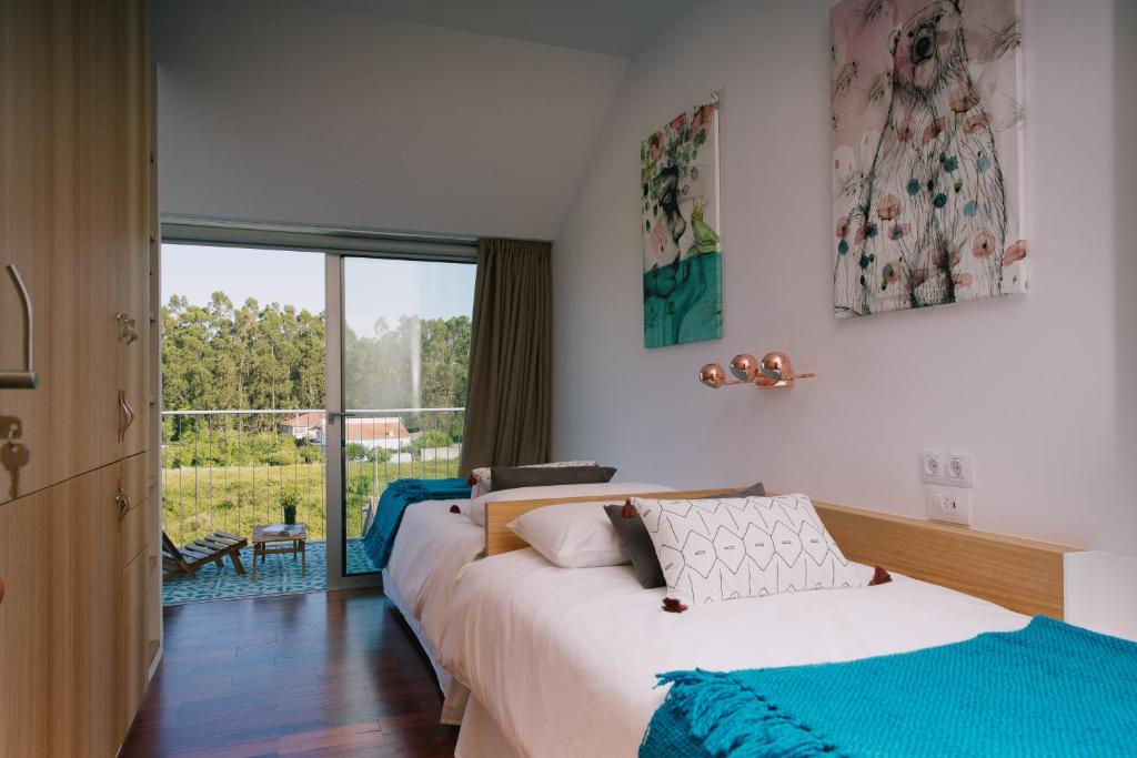 A bed or beds in a room at roomAREA vivienda turistica