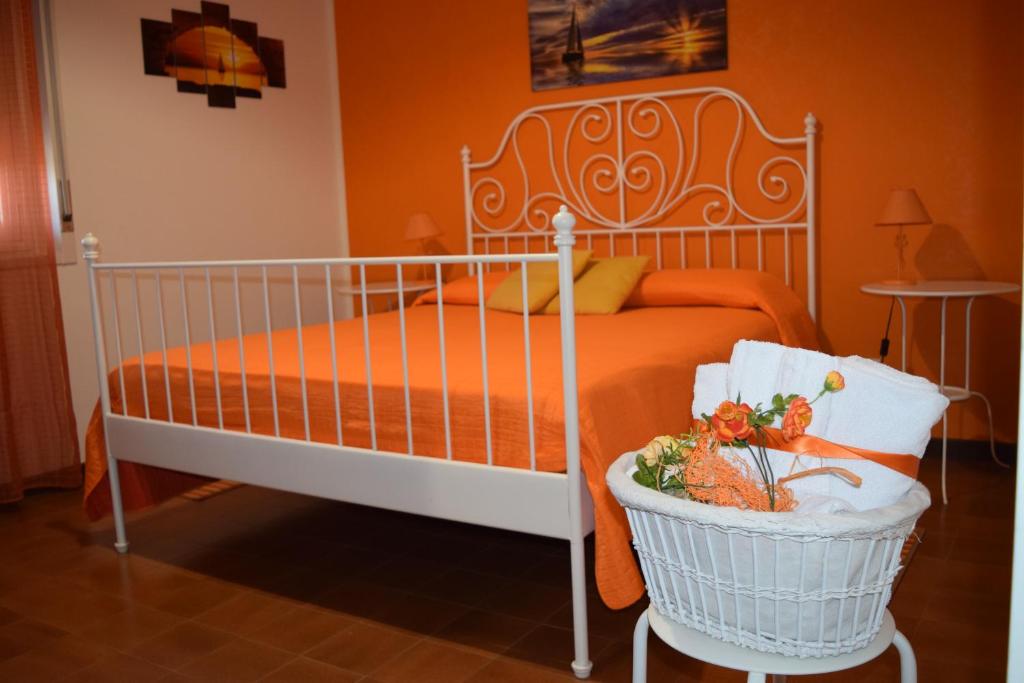 a bedroom with a bed and a basket of vegetables at Vista sul porto in Palermo