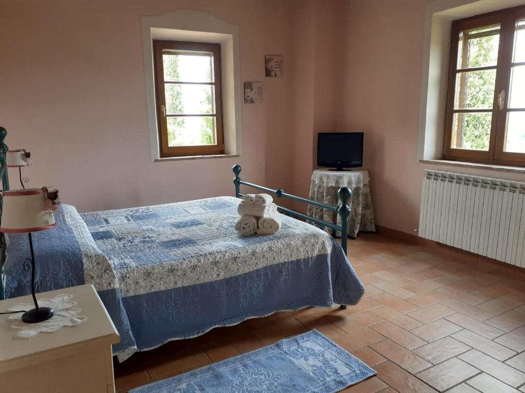Postel nebo postele na pokoji v ubytování Podere Cacchini