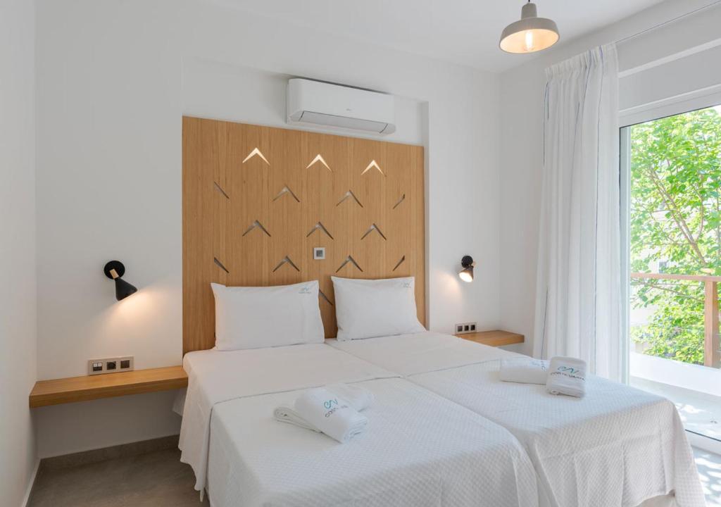 Katil atau katil-katil dalam bilik di COSTA VASIA Seaside Suites and Apartments