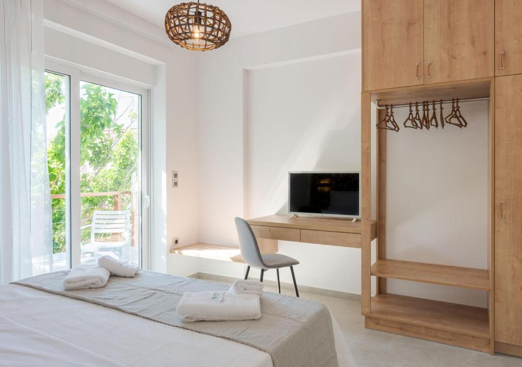 Katil atau katil-katil dalam bilik di COSTA VASIA Seaside Suites and Apartments