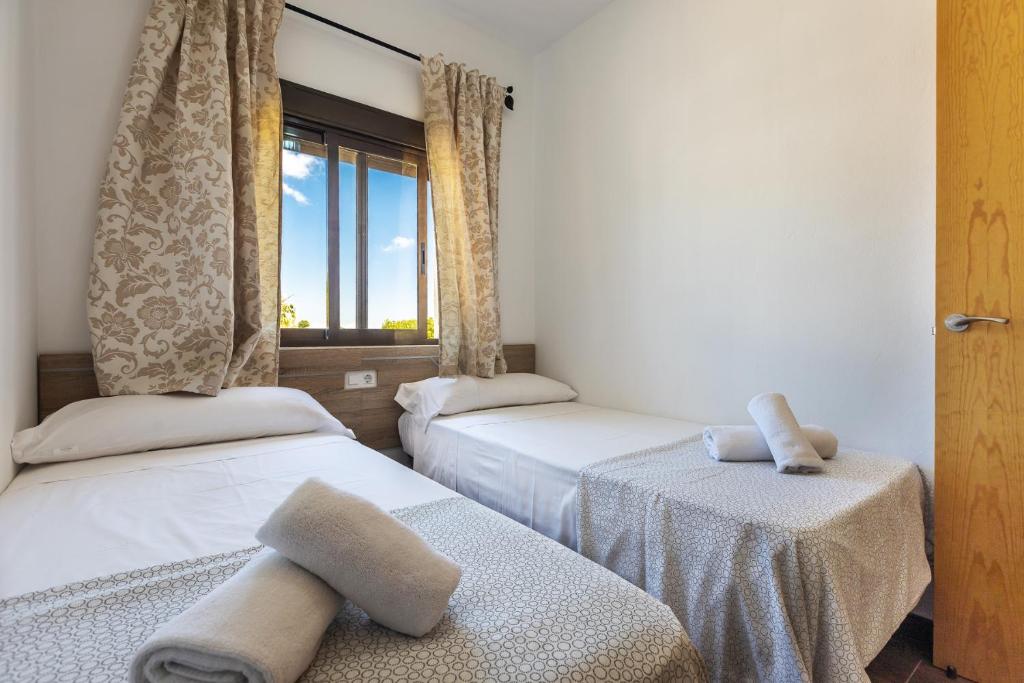 Postel nebo postele na pokoji v ubytování APARTAMENTO BOLONIA SUR A