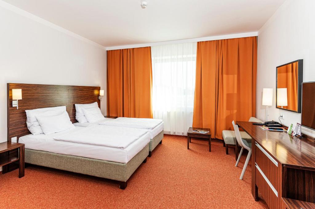 Postel nebo postele na pokoji v ubytování Hotel Euro