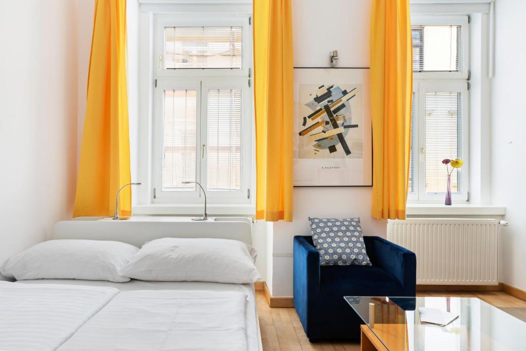 Łóżko lub łóżka w pokoju w obiekcie GAL Apartments Vienna
