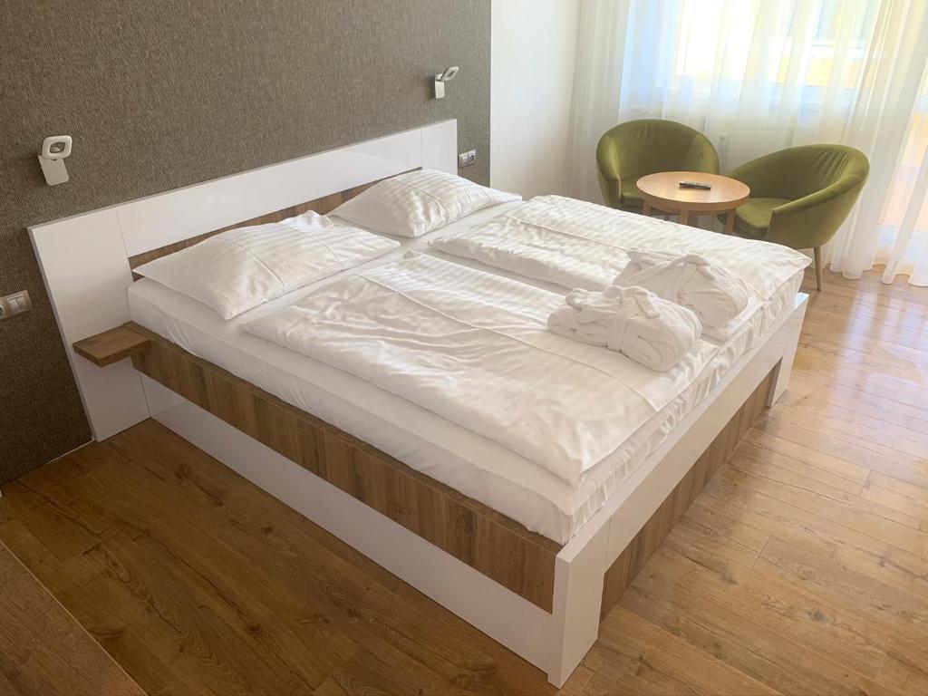 Łóżko lub łóżka w pokoju w obiekcie Wellness & Spa Apartments Lipno - Frymburk