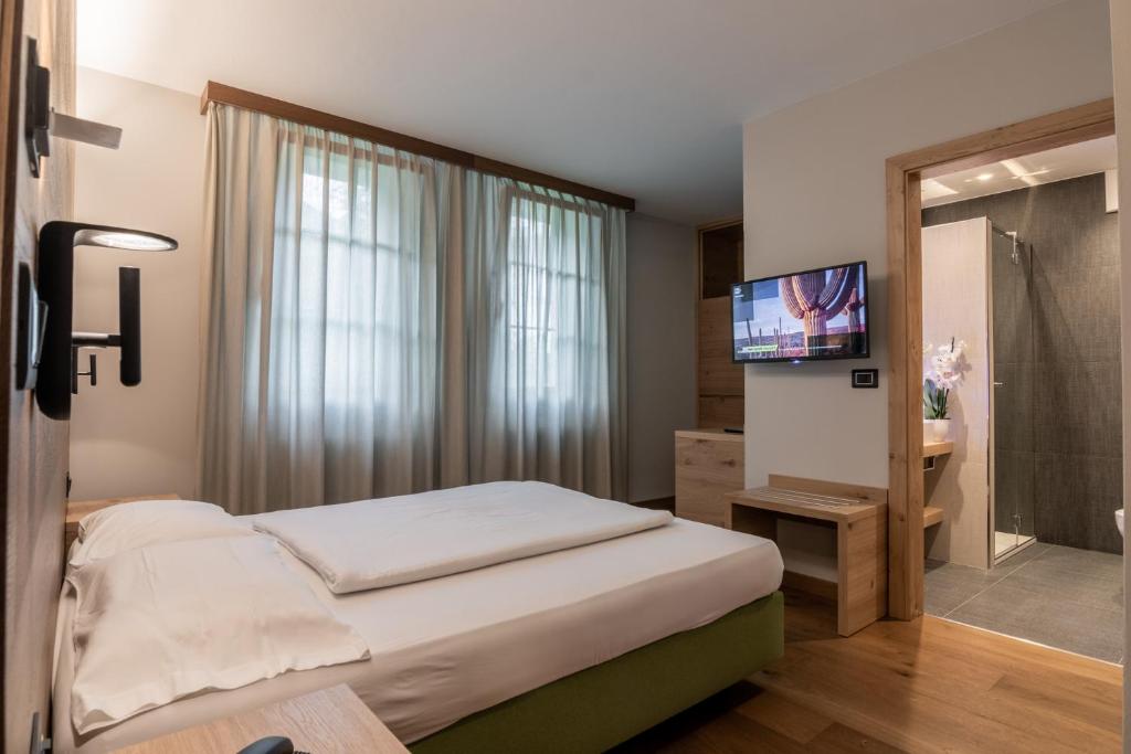 Postel nebo postele na pokoji v ubytování Hotel Sole