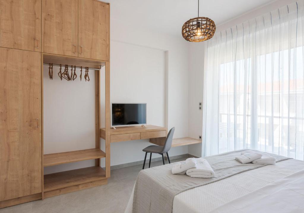 Katil atau katil-katil dalam bilik di COSTA VASIA Seaside Suites and Apartments
