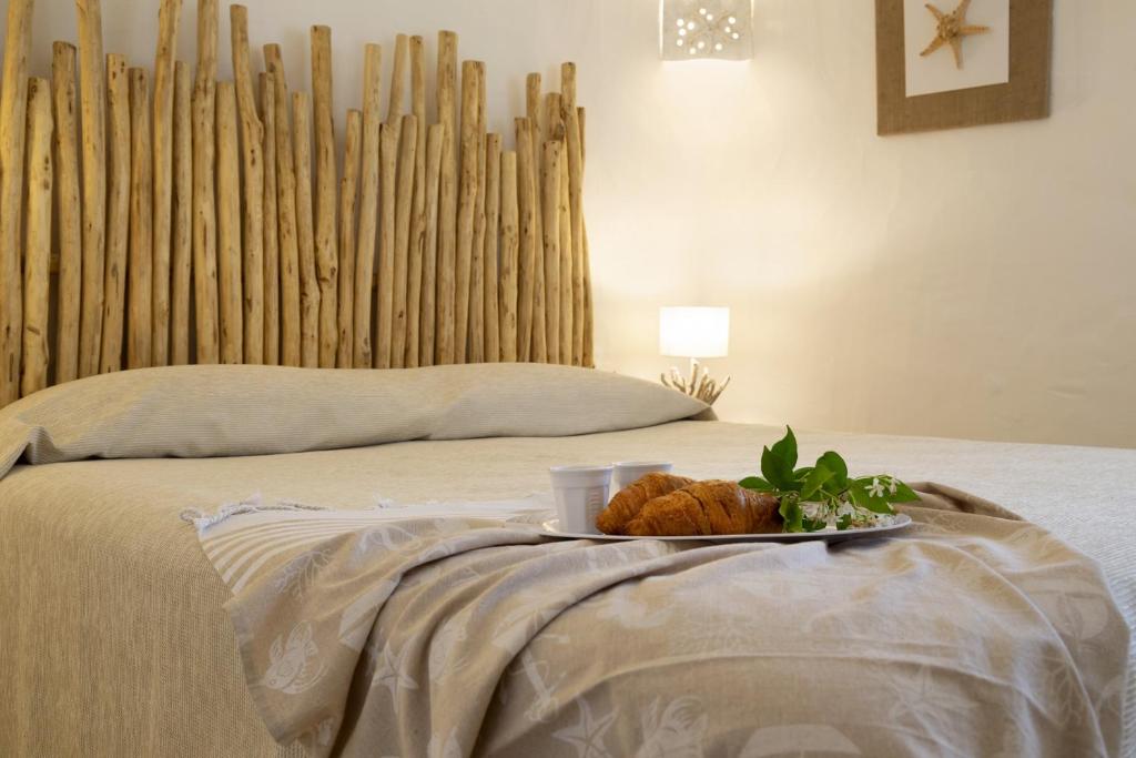 Łóżko lub łóżka w pokoju w obiekcie Residence Capraggia