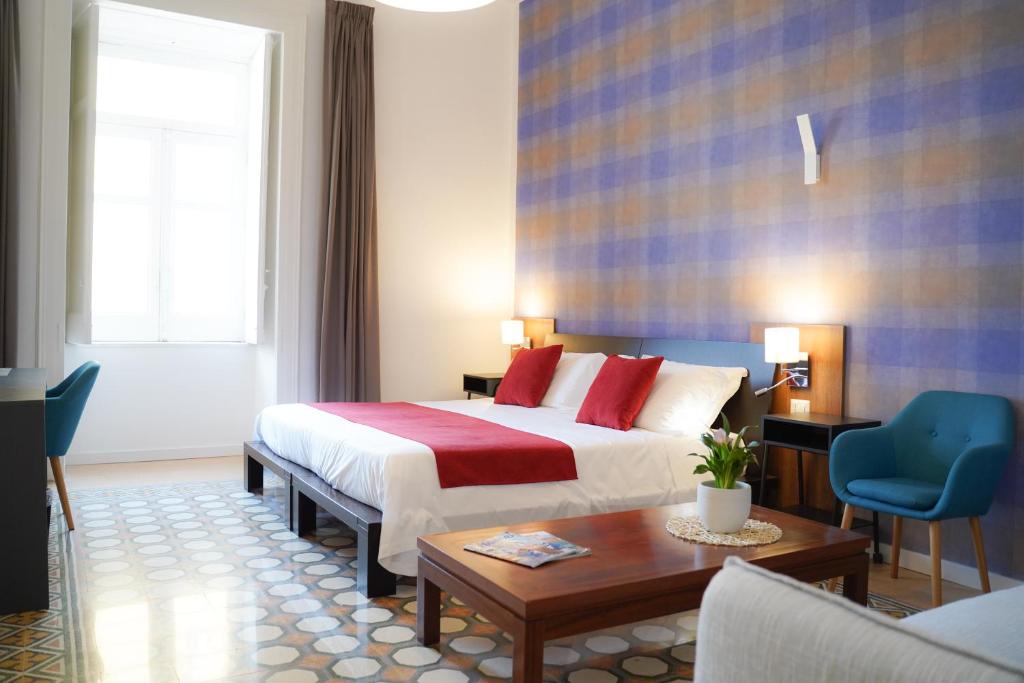 Postel nebo postele na pokoji v ubytování Hotel Cimarosa