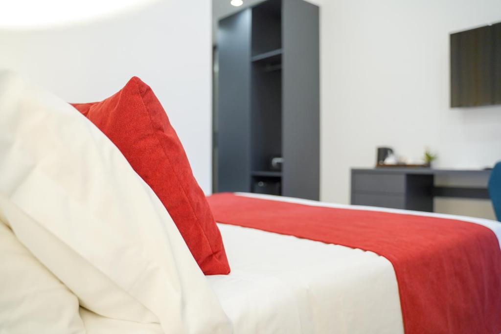 Postel nebo postele na pokoji v ubytování Hotel Cimarosa