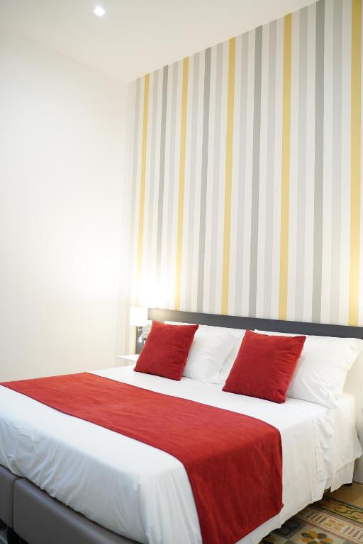 Postel nebo postele na pokoji v ubytování Hotel Cimarosa