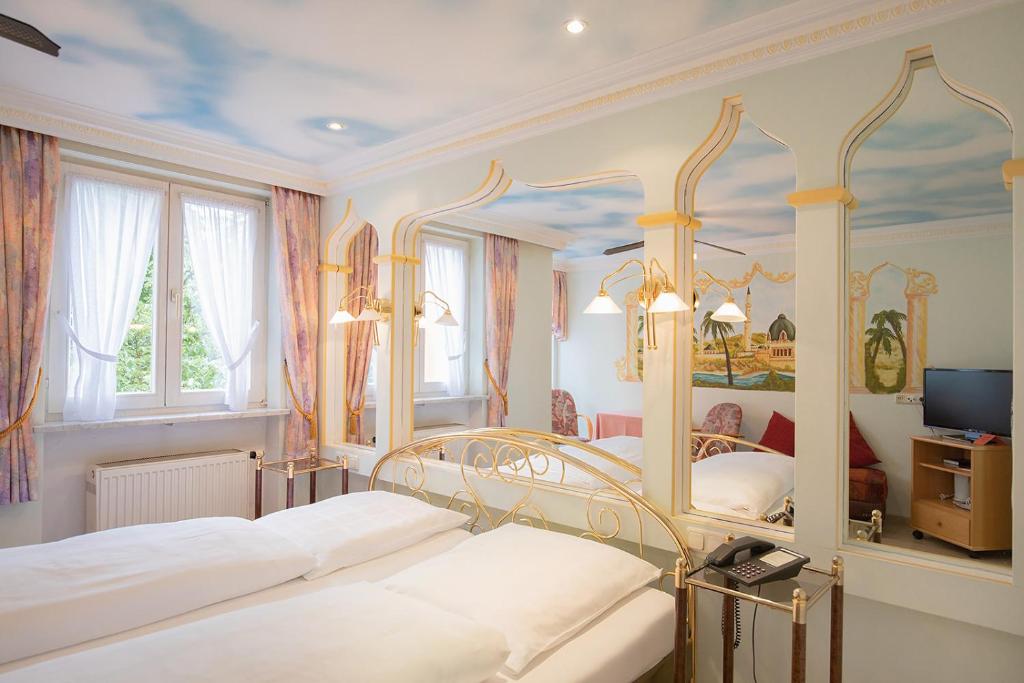 Postel nebo postele na pokoji v ubytování Hotel Plankl