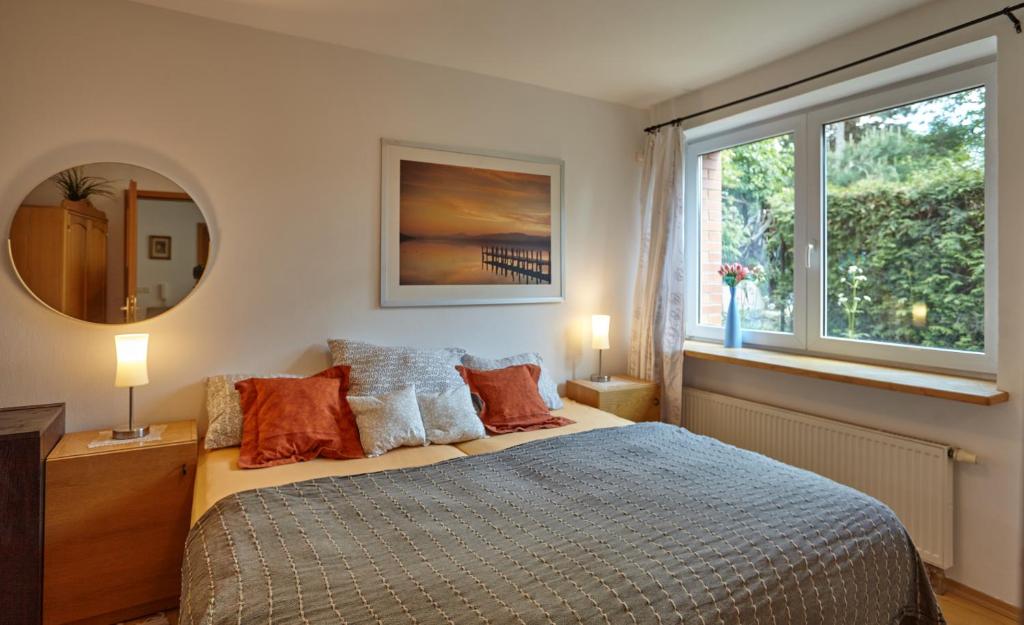 a bedroom with a bed and a large window at Villa In Bio Garden - You Will Save Money Here in Prague