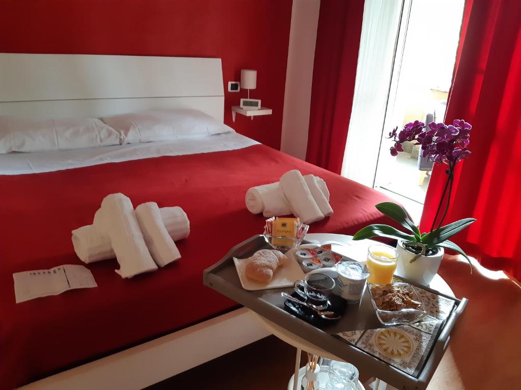 Łóżko lub łóżka w pokoju w obiekcie AD Trastevere Guest House - by AD Roma