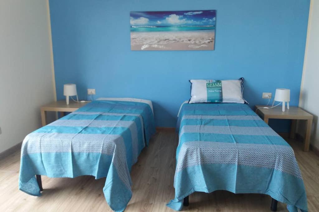 Posteľ alebo postele v izbe v ubytovaní Terrazza sul Mare Vecchio Pontile