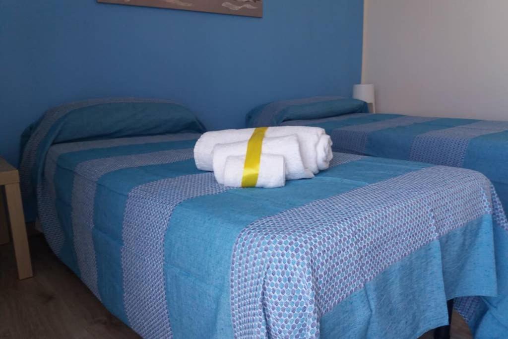 Posteľ alebo postele v izbe v ubytovaní Terrazza sul Mare Vecchio Pontile
