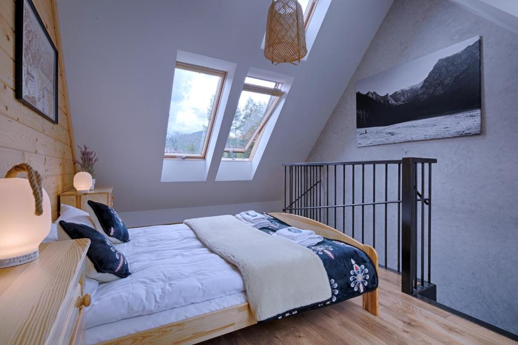 Posteľ alebo postele v izbe v ubytovaní Apartamenty Biatlonowe