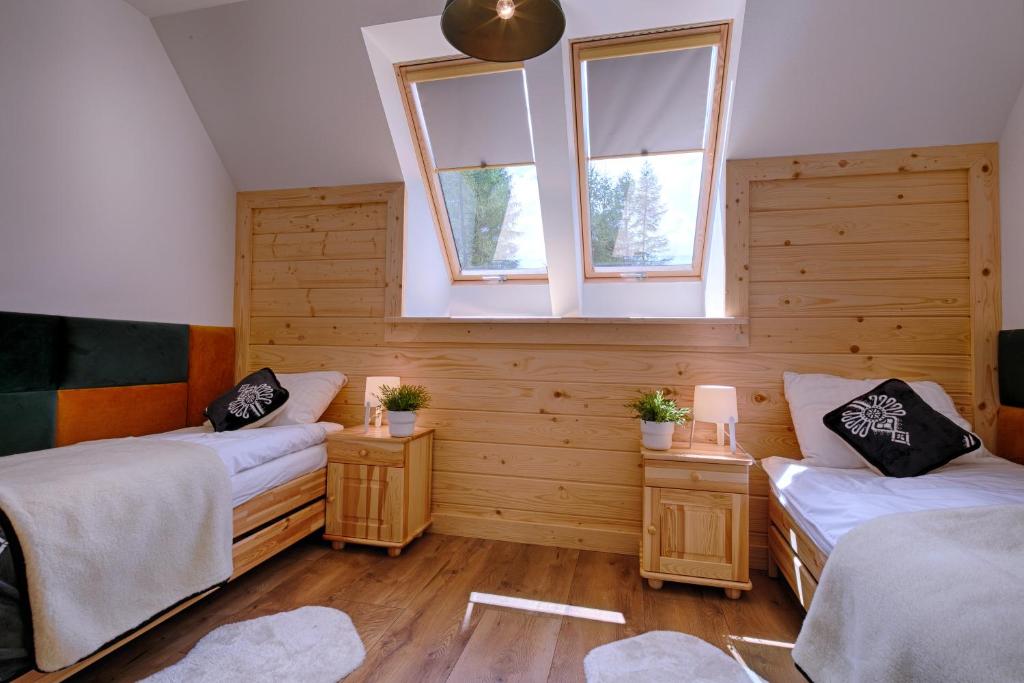 Posteľ alebo postele v izbe v ubytovaní Apartamenty Biatlonowe