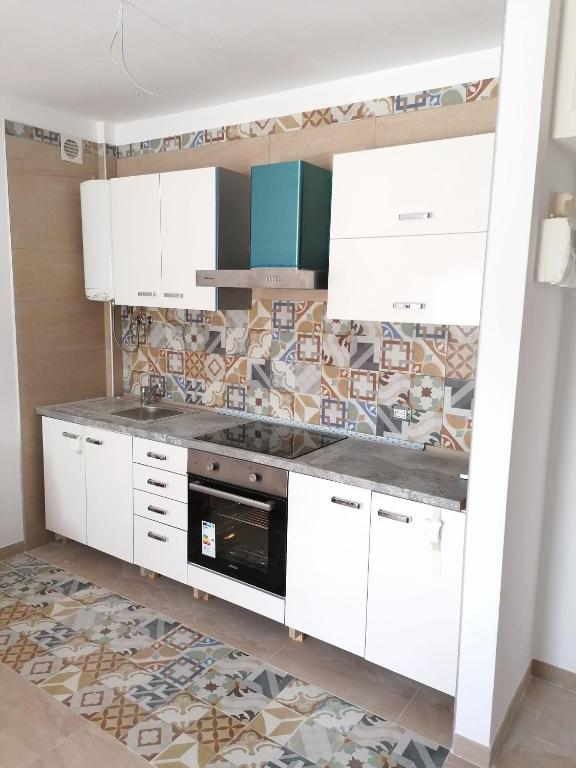 Kuchnia lub aneks kuchenny w obiekcie colina apartment
