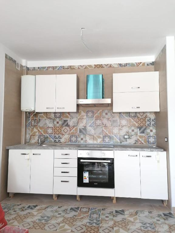Kuchnia lub aneks kuchenny w obiekcie colina apartment