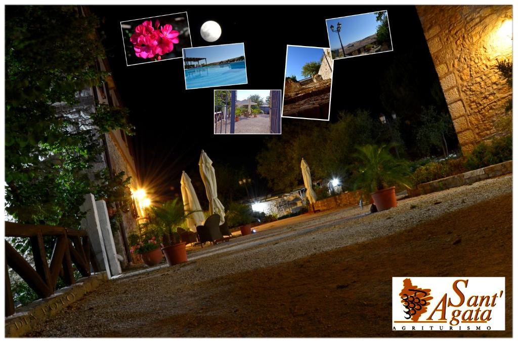 a group of pictures hanging off the side of a building at night at Agriturismo Sant'Agata in Piana degli Albanesi