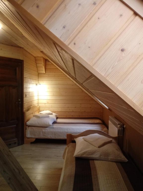 Postel nebo postele na pokoji v ubytování Dom Gościnny BIERWIONO
