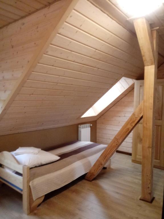 Postel nebo postele na pokoji v ubytování Dom Gościnny BIERWIONO