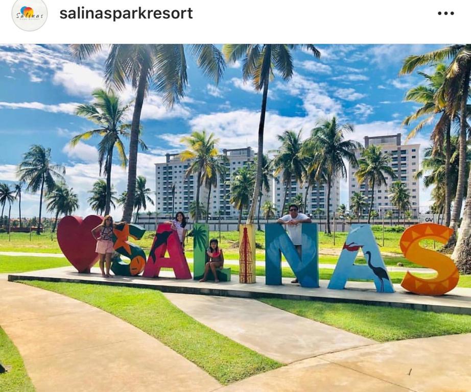 a sign that says santa cruz in a park at Salinas Parks in Salinópolis