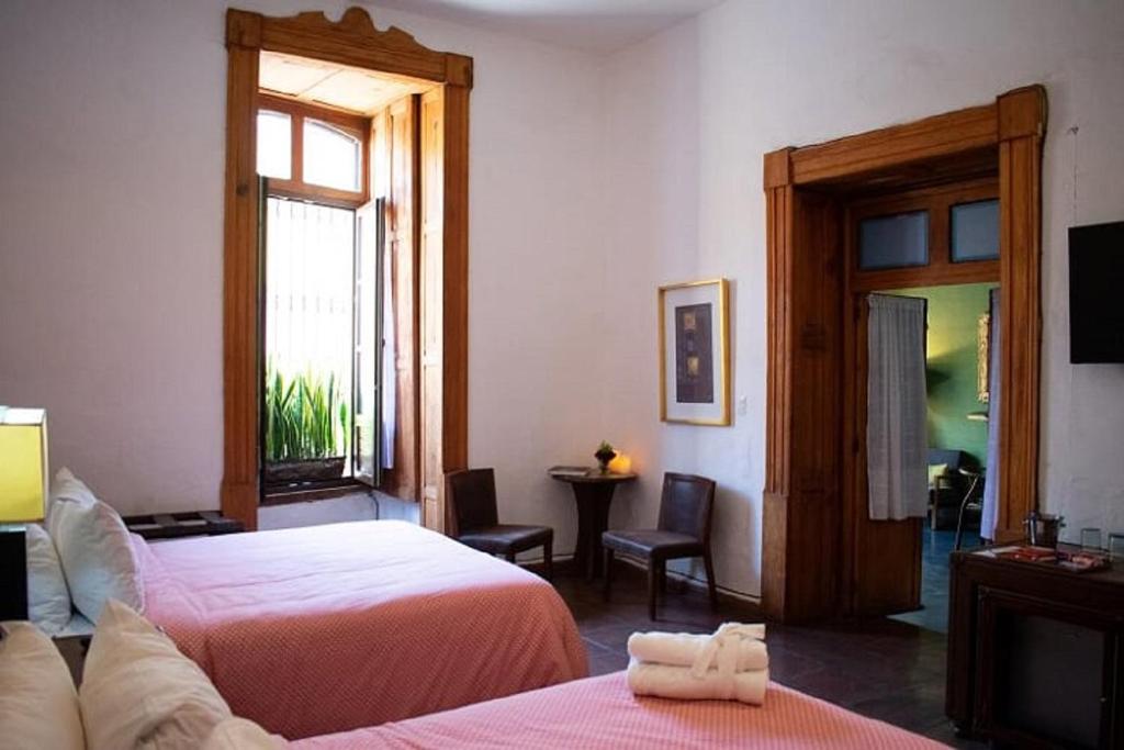 Postel nebo postele na pokoji v ubytování Casa Aspeytia Hotel Boutique