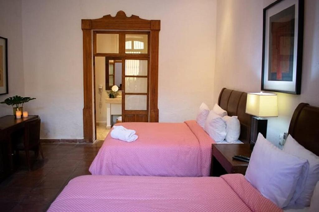 Postel nebo postele na pokoji v ubytování Casa Aspeytia Hotel Boutique
