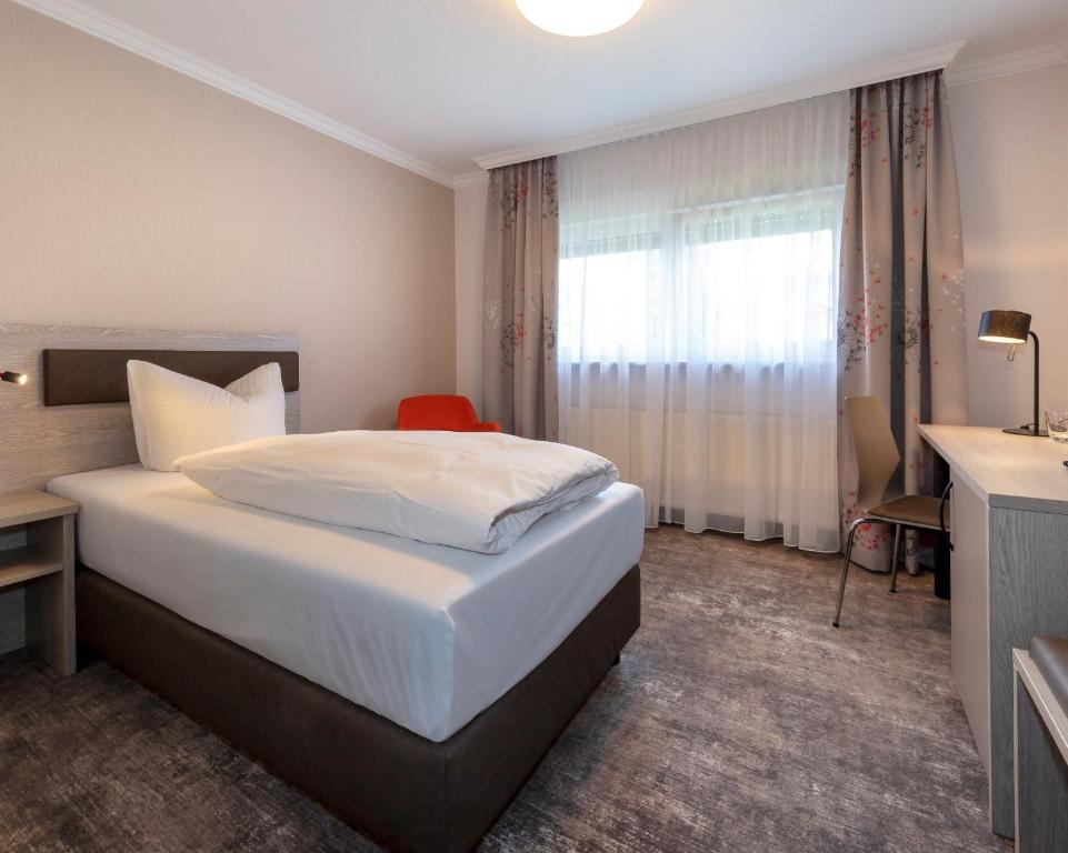 Postel nebo postele na pokoji v ubytování Hotel Alte Bäckerei