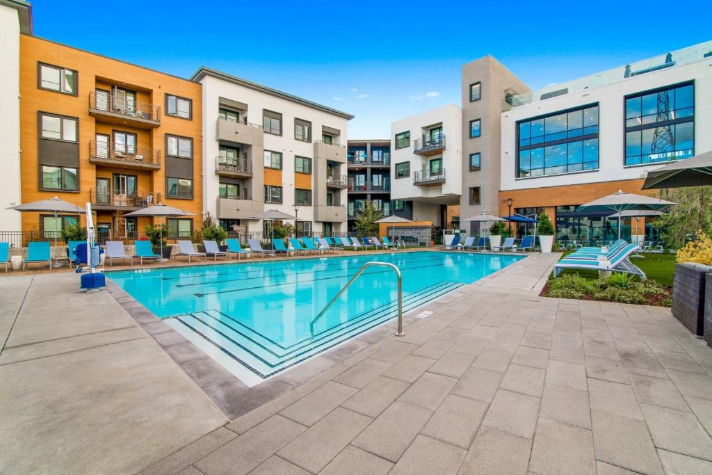 an image of a swimming pool at a apartment complex at Churchill Living at Anton Menlo in Menlo Park