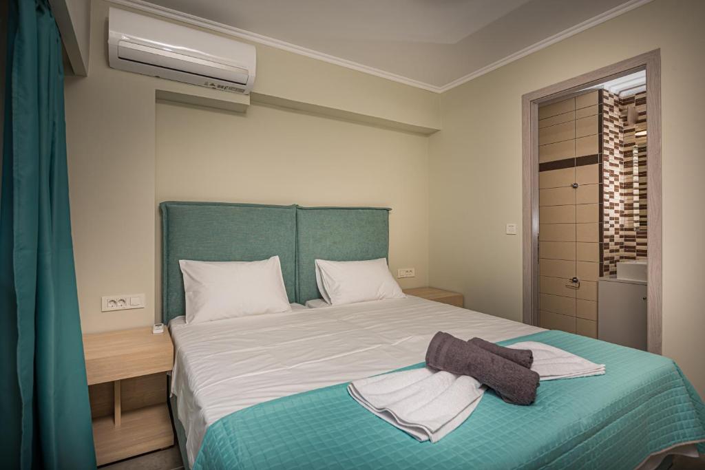 Postel nebo postele na pokoji v ubytování Metsovo Big Apts