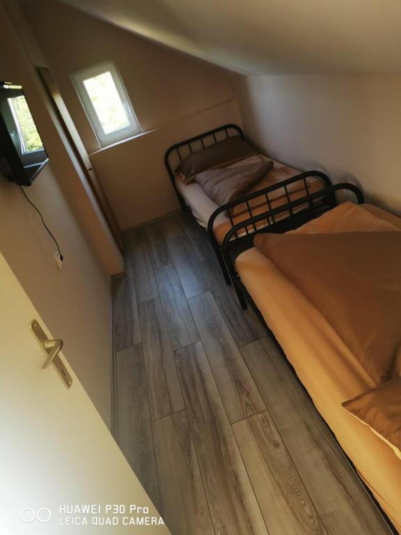 Postel nebo postele na pokoji v ubytování Renáta Apartman