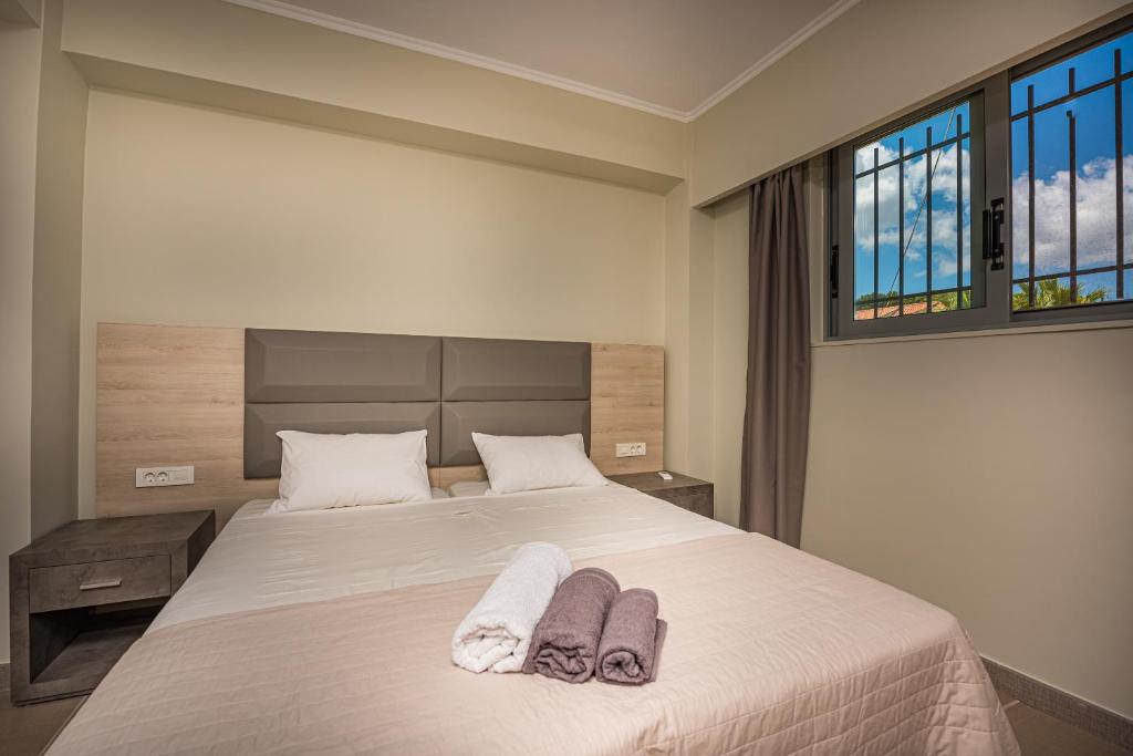 Postel nebo postele na pokoji v ubytování Metsovo Big Apts