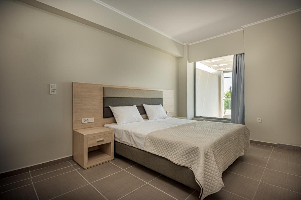 Postel nebo postele na pokoji v ubytování Metsovo Big Apts