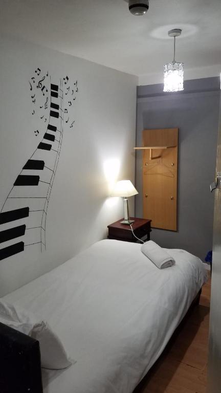 Postel nebo postele na pokoji v ubytování City View Hotel Roman Road