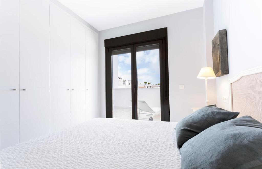 Posteľ alebo postele v izbe v ubytovaní Conil Luz de Mar