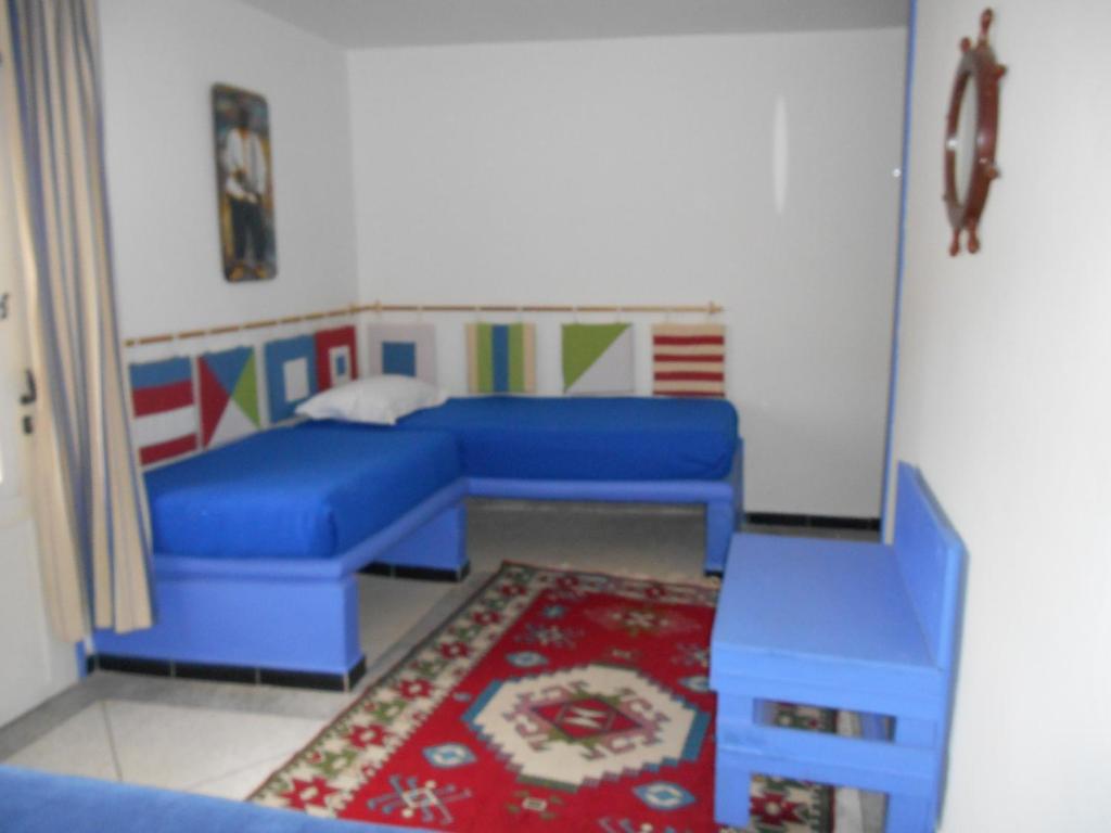 Postel nebo postele na pokoji v ubytování Tigmi Dar Samy