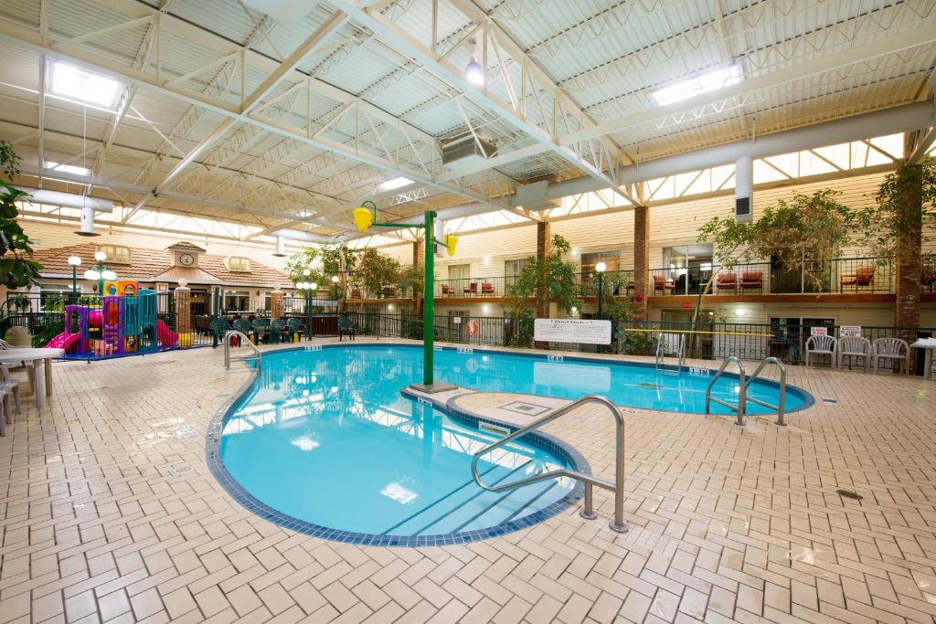 a large swimming pool in a large building at Victoria Inn Hotel & Convention Centre Brandon in Brandon