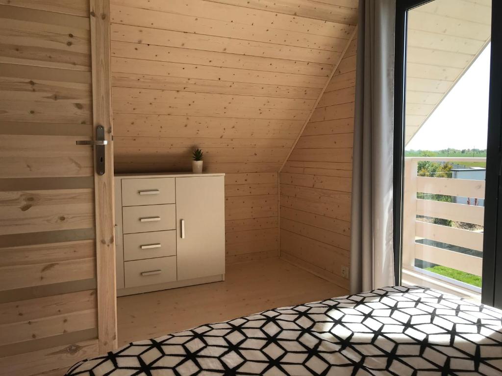 Postel nebo postele na pokoji v ubytování White Houses Rewal