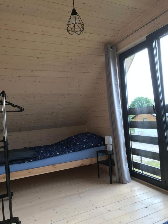 Postel nebo postele na pokoji v ubytování White Houses Rewal