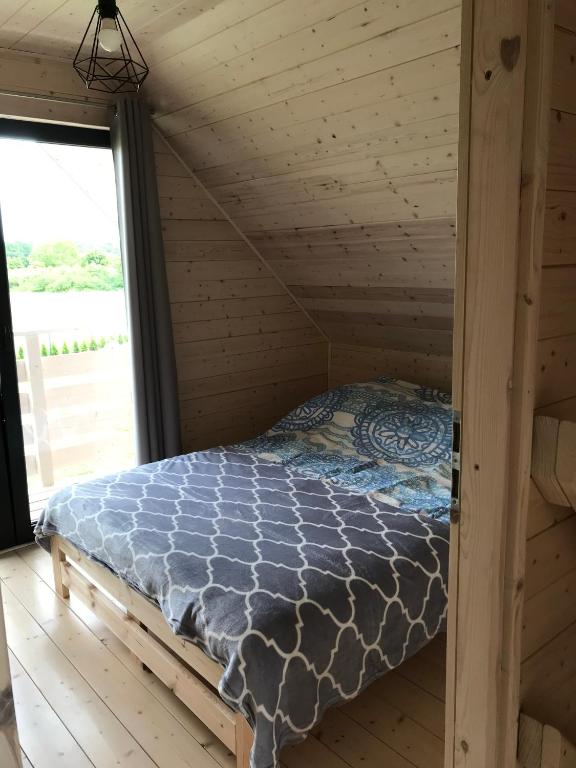 Postel nebo postele na pokoji v ubytování White Houses Rewal