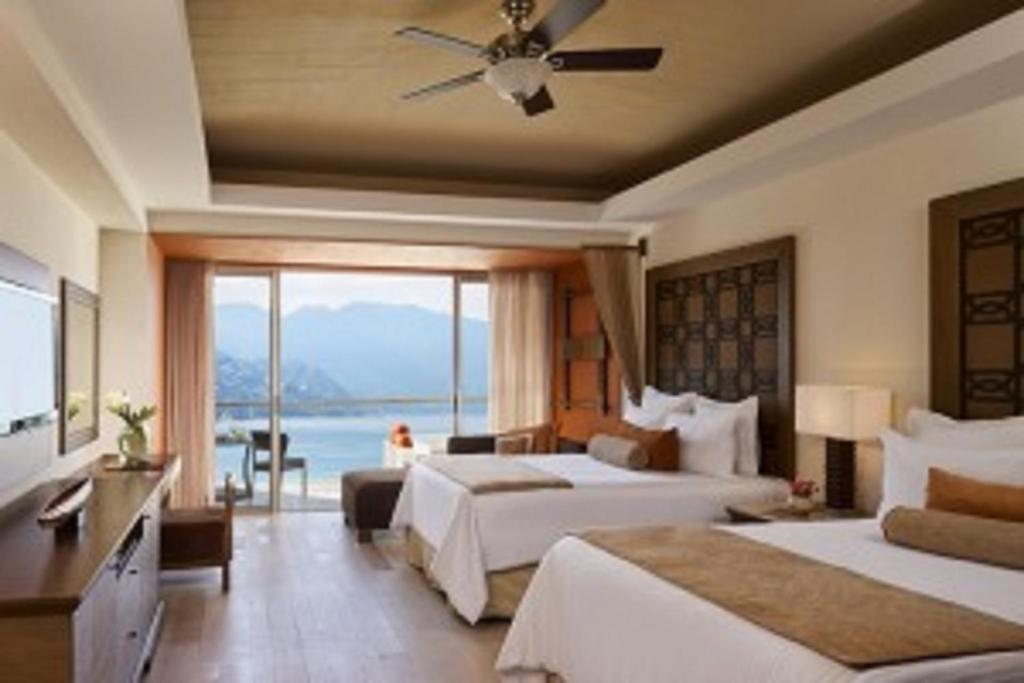 Postel nebo postele na pokoji v ubytování Dreams Vallarta Bay Resorts & Spa - All Inclusive