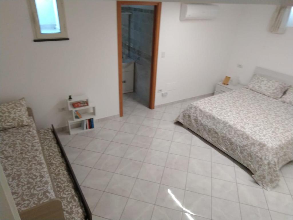 Postel nebo postele na pokoji v ubytování AMAA CASA