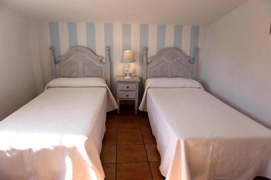 Postel nebo postele na pokoji v ubytování Villa las Tinajas Luxury