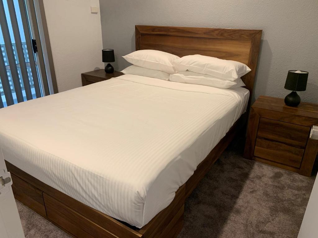 Postel nebo postele na pokoji v ubytování Reef Resort Villas Port Douglas