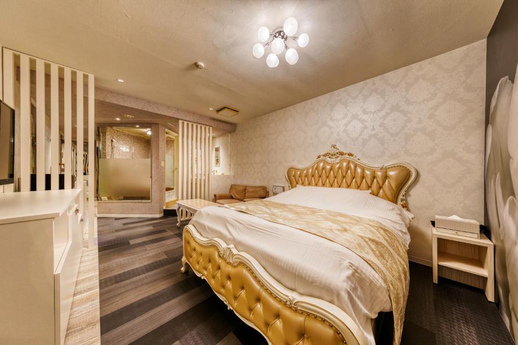 Postel nebo postele na pokoji v ubytování Hotel Luna Ibaraki(Adult Only)