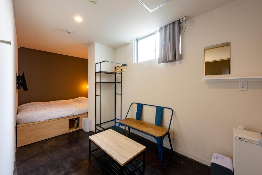 Postel nebo postele na pokoji v ubytování plat hostel keikyu minowa forest